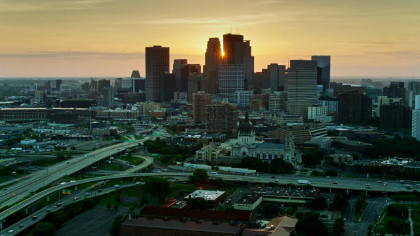 istock Morning Sun Appearing Between Minneapolis Skyscrapers- Drone Shot 1287727819