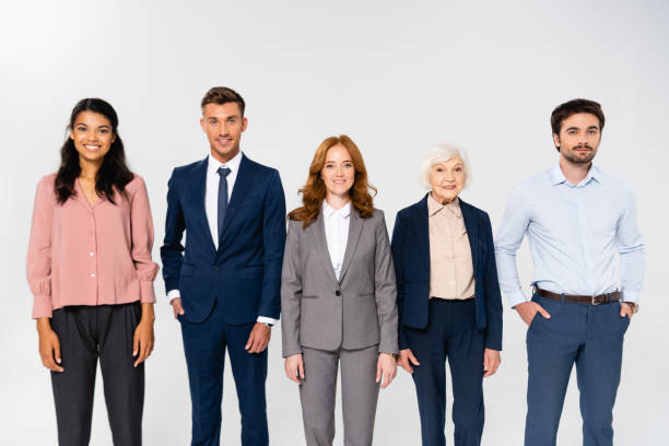 istock Cheerful multiethnic businesspeople looking at camera isolated on grey 1287728289
