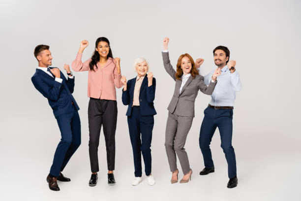 istock Cheerful multiethnic businesspeople showing yes gesture on grey background 1287728315