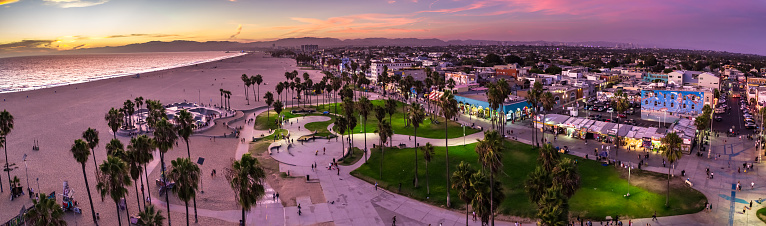Stitched panoramic shot of Venice Beach at twilight.