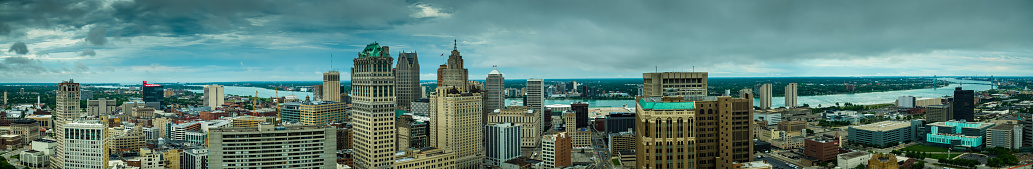 Stitched panoramic shot of Downtown Detroit from the air. Windsor, Ontario can be seen on the other side of the river.