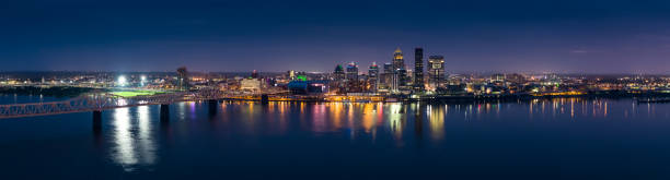 Downtown Louisville at Twilight - Aerial Panorama Stitched panoramic shot of Louisville, Kentucky on the banks of the Ohio River from the air. louisville kentucky stock pictures, royalty-free photos & images