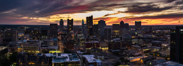 Fiery Sunset Behind Columbus, Ohio - Aerial Panorama Stitched panoramic shot of Columbus, including the Ohio Statehouse, at twilight from the air. ohio ohio statehouse columbus state capitol building stock pictures, royalty-free photos & images