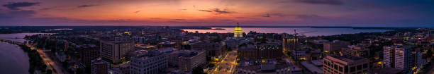 Aerial Panorama of Madison, Wisconsin at Sunset Stitched panoramic shot of the Wisconsin State Capitol building in Madison from the air. madison wisconsin stock pictures, royalty-free photos & images