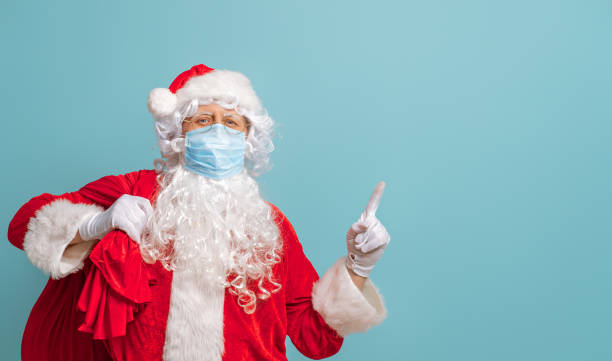 istock Santa Claus in face mask during Covid-2019 1287731787