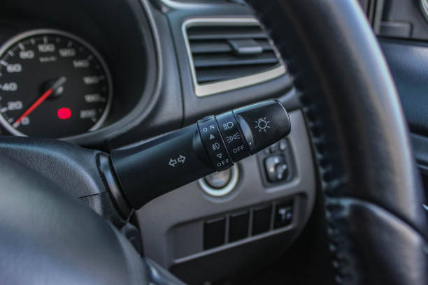 istock Switch off lights in a car. close-up Car integrated turning indicator with headlight switch toggle. 1287734974
