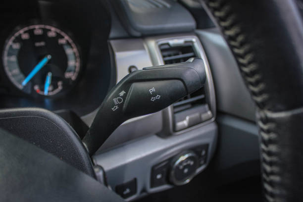 istock Switch off lights in a car. close-up Car integrated turning indicator with headlight switch toggle. 1287734982