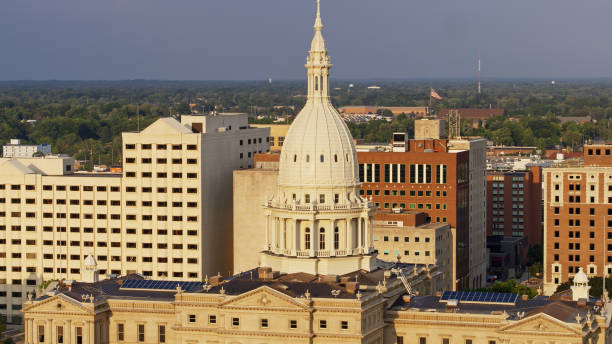 istock US Flag Flying Behind Michigan State Capitol Dome 1287743550
