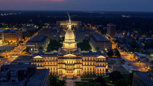 istock Drone View of Michigan State Capitol Lit Up at Night 1287743564