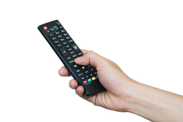 istock His hand is holding the remote control and operate the remote control. on the White Background . Concept of Technology 1287743862