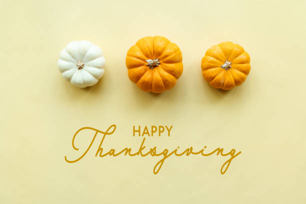 istock Happy Thanksgiving Day with pumpkin on yellow background 1287755389