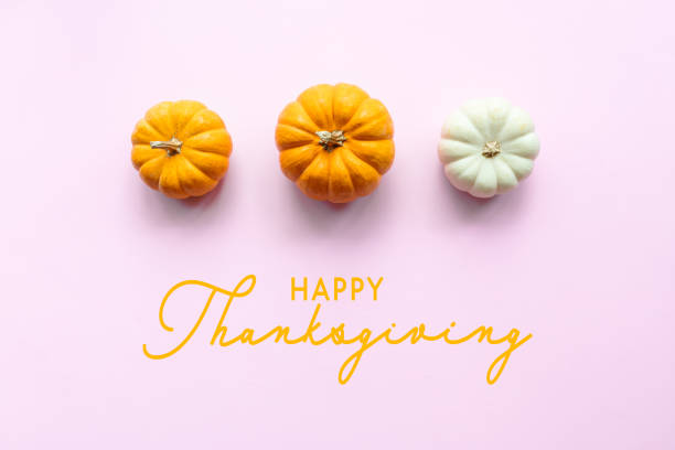 istock Happy Thanksgiving Day with pumpkin on pink background 1287755446