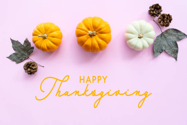 istock Happy Thanksgiving Day with pumpkin and maple leaf 1287755455