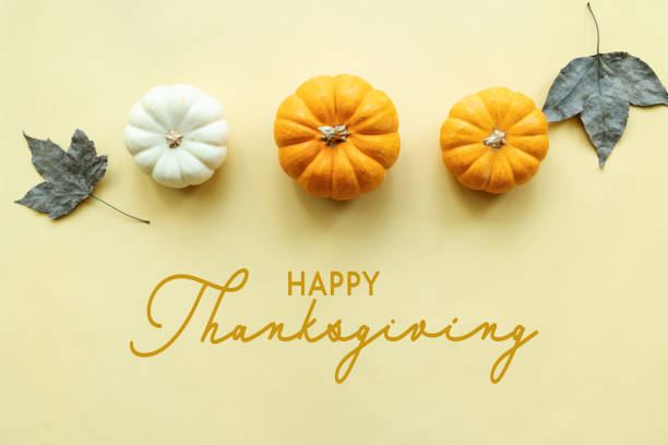 istock Happy Thanksgiving Day with pumpkin and maple leaf 1287755472