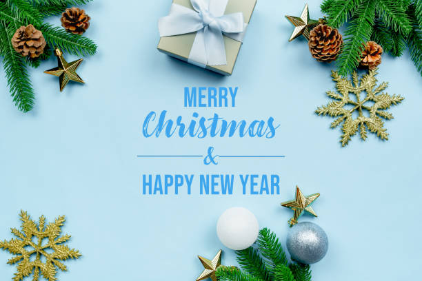 istock Christmas present and pine tree with xmas decoration on blue background 1287755828