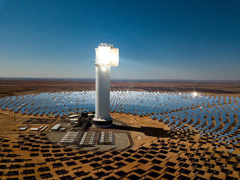 A high view of heliostats and central generating tower at the Khi Solar One solar energy generation plant in the desert near Keimoes and Upington in the Northern Cape, South Africa.