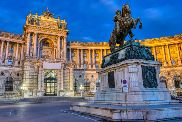 The Prinz Eugen Statue with part of the Hofburg The Prinz Eugen Statue with part of the Hofburg in Vienna at night the hofburg complex stock pictures, royalty-free photos & images