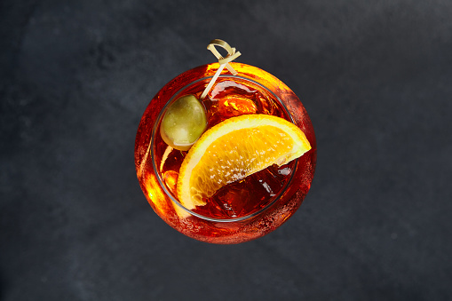Classic Spritz cocktail. Spritz cocktail on dark background. Fresh orange drink. Festive christmas background.