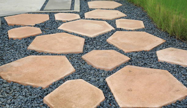 istock Stone path walk way on gravel in the garden 1287767903