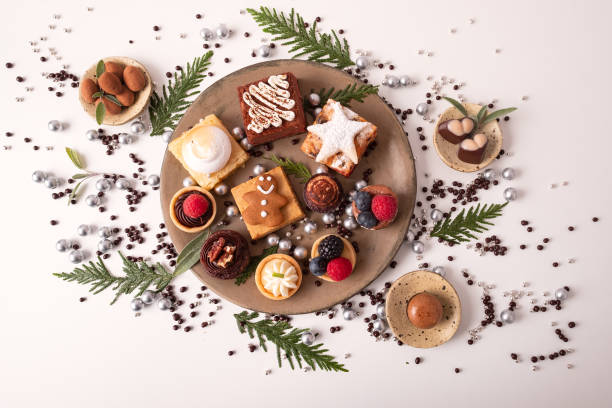 istock Christmas Dessert Plate, Vegan Candy on Small Plates and Background 1287768224