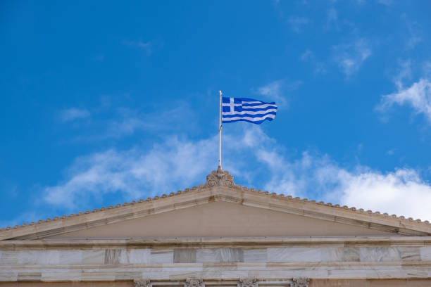 istock Greek flag waving against blue sky background. 1287768893
