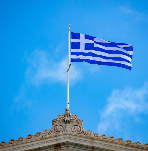 istock Greek flag waving against blue sky background. 1287768913