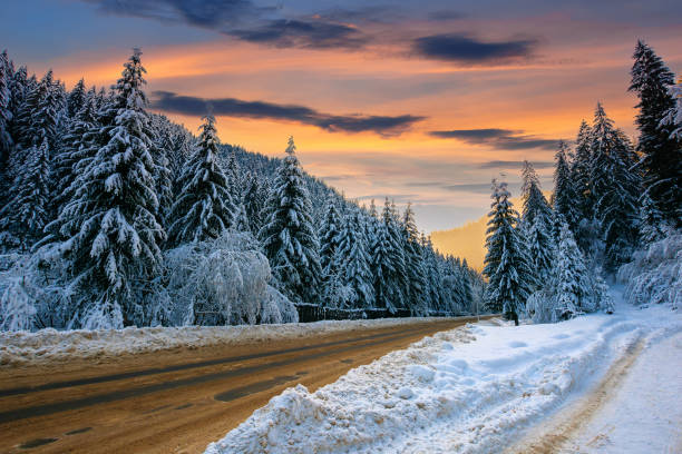 istock road through mountain landscape in winter 1287769321