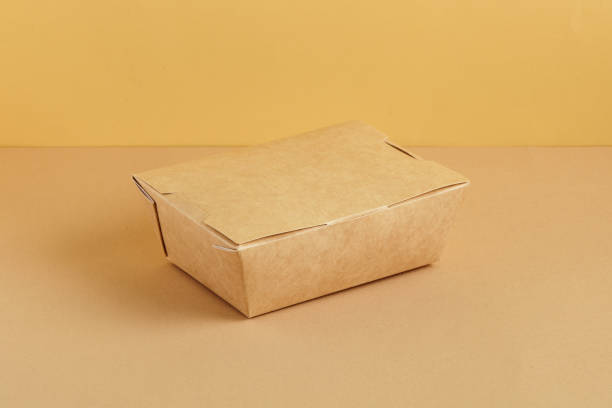 istock Brown paper food box. Ground color background 1287773261