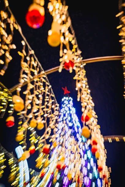 istock Christmas tree with garlands of lights. 1287777880