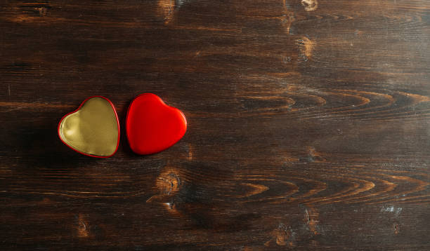 istock Heart Gift Box on a Rustic Wooden Table 1287779515