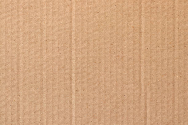 istock Brown cardboard sheet abstract background, texture of recycle paper box in old vintage pattern for design art work. 1287784233