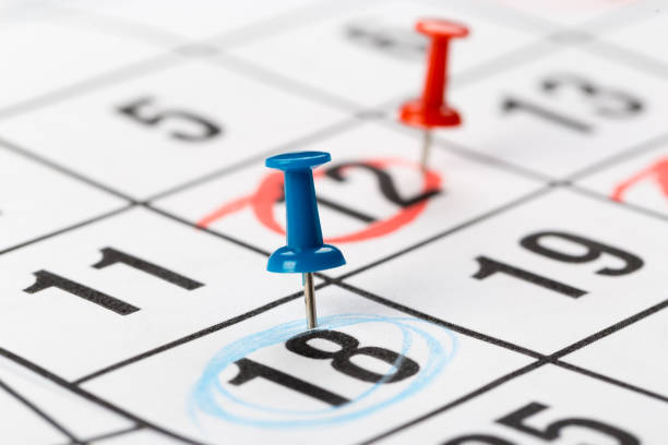 istock Push pins on calendar. Idea concept of to do planning. 1287784572
