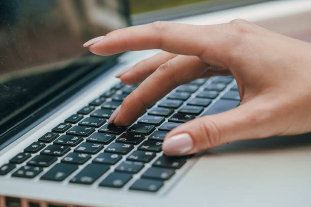 istock woman using laptop, searching the internet, viewing information, having a job at home 1287784606