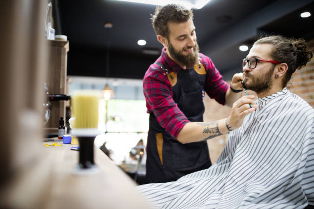 istock Client during beard and moustache grooming in barber shop 1287787567