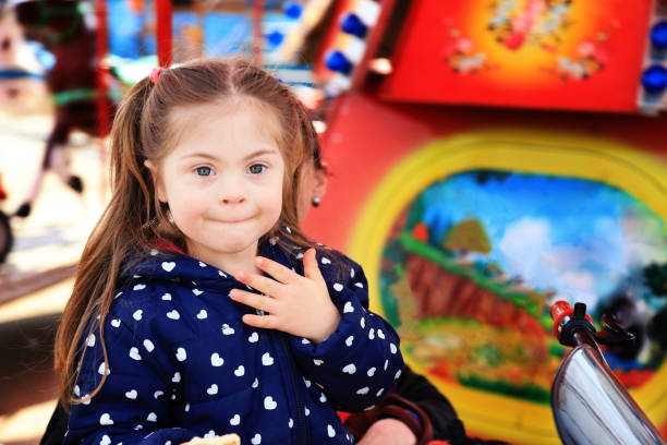 istock Little girl having fun in amusement park 1287791115