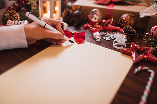 Woman writing a Christmas card
