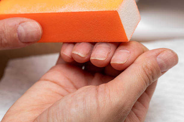 istock Nail polishing with file during manicure close up 1287794656