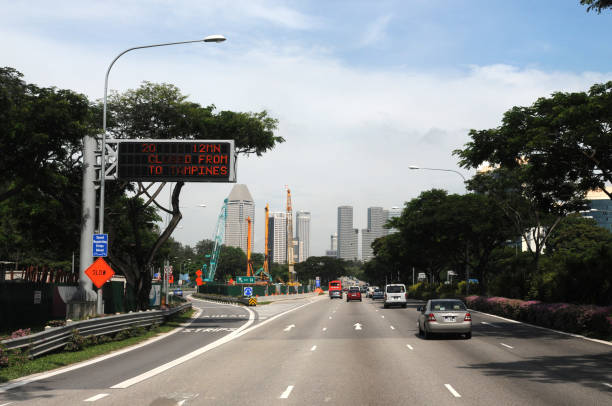 The view of the highway from Changi Airport to downtown Singapore is overgrown with green trees on April 19, 2010