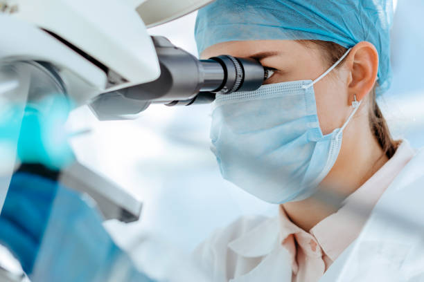 istock female scientist using a microscope in a medical laboratory 1287800857