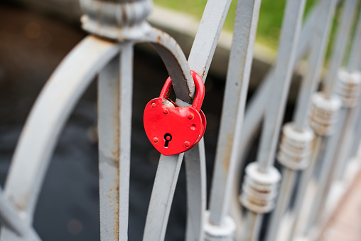 heart shaped lock on the grey bridge