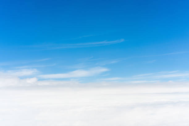 istock Take pictures of clouds in the sky while flying 1287802573