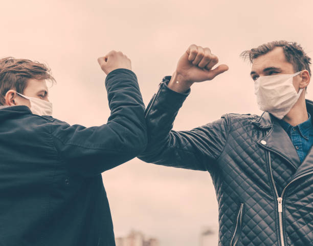 istock young people with a gesture of greeting each other 1287802731