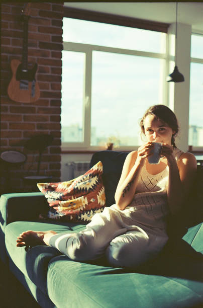 istock Woman drinking tea/coffee on sunny morning at home 1287804210