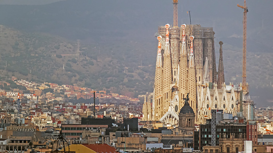 Barcelona, Spain - December 19, 2019: Gaudi's Sagrada Familia in winter from far away.