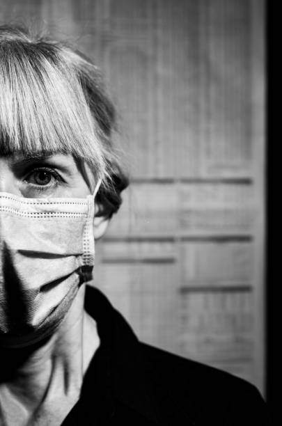 istock Woman wearing a face mask 1287805977