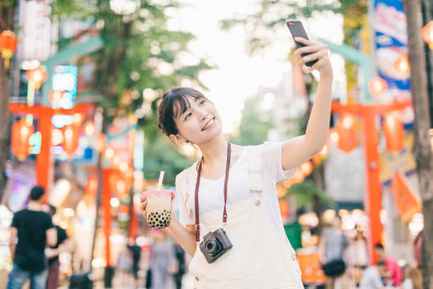 istock Asian woman taking a selfie 1287806010