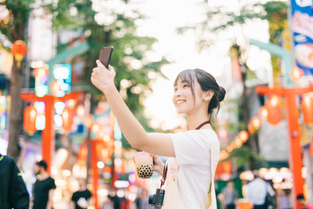 istock Asian woman taking a selfie 1287806014