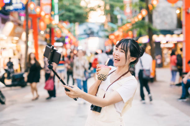 istock Asian woman taking a selfie 1287806018