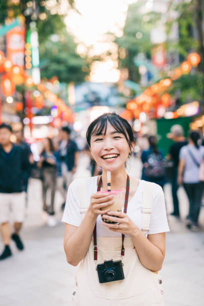 istock Taiwanese woman with bubble tea 1287806022
