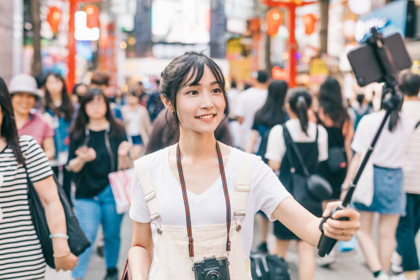 istock Young asian influencer vlogging in the city 1287806042